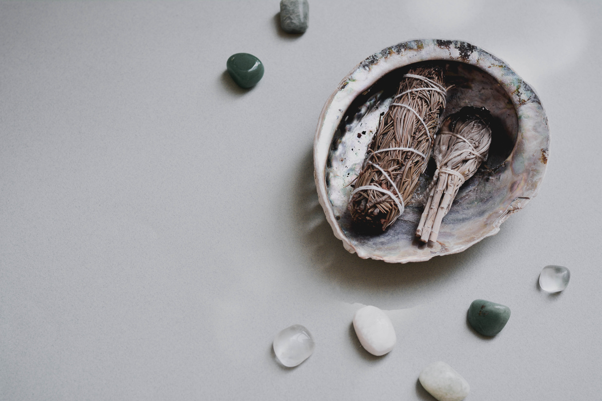 Close-Up Shot of Gemstones beside a Shell